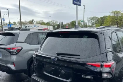 Rows of new vehicles at a dealership as hybrid demand increases in the U.S. market