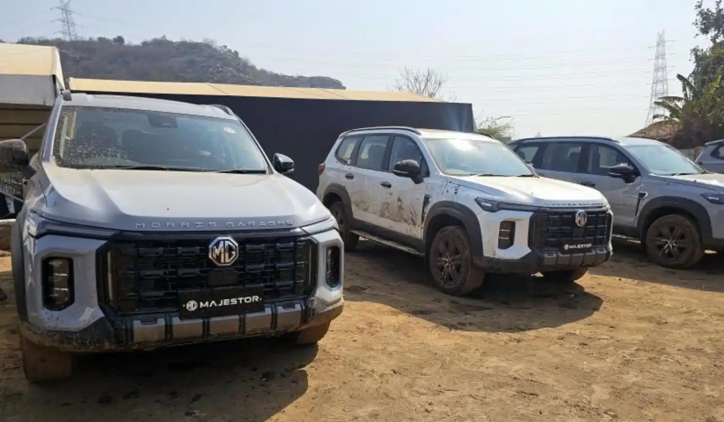 MG Majestor SUV navigating a challenging off-road course with crawl control and differential locks engaged.