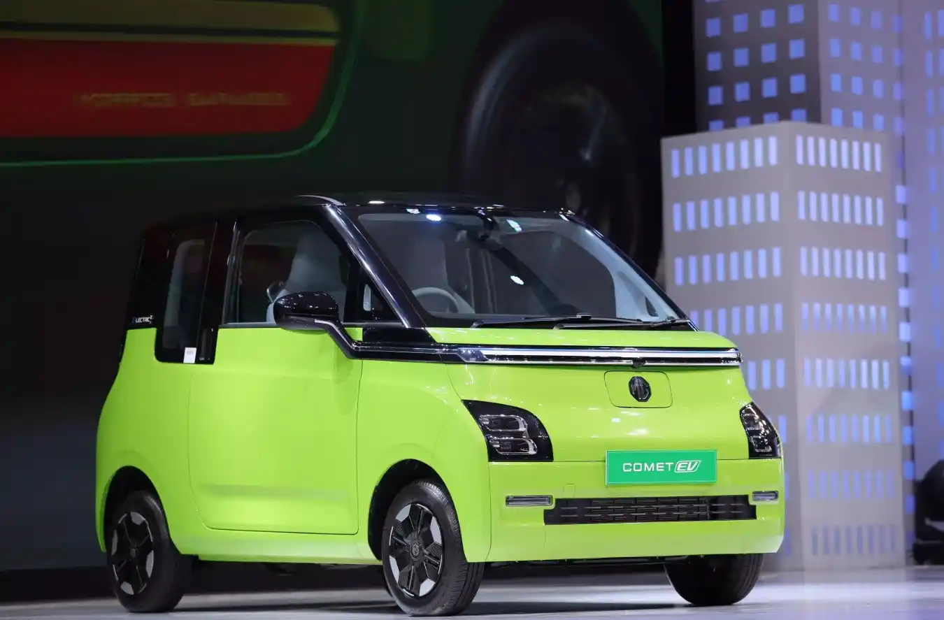 MG Comet EV compact electric car parked in urban city street showing futuristic design and small footprint mobility solution