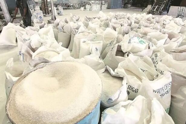 Indian sugar market with raw sugar being processed at a refinery