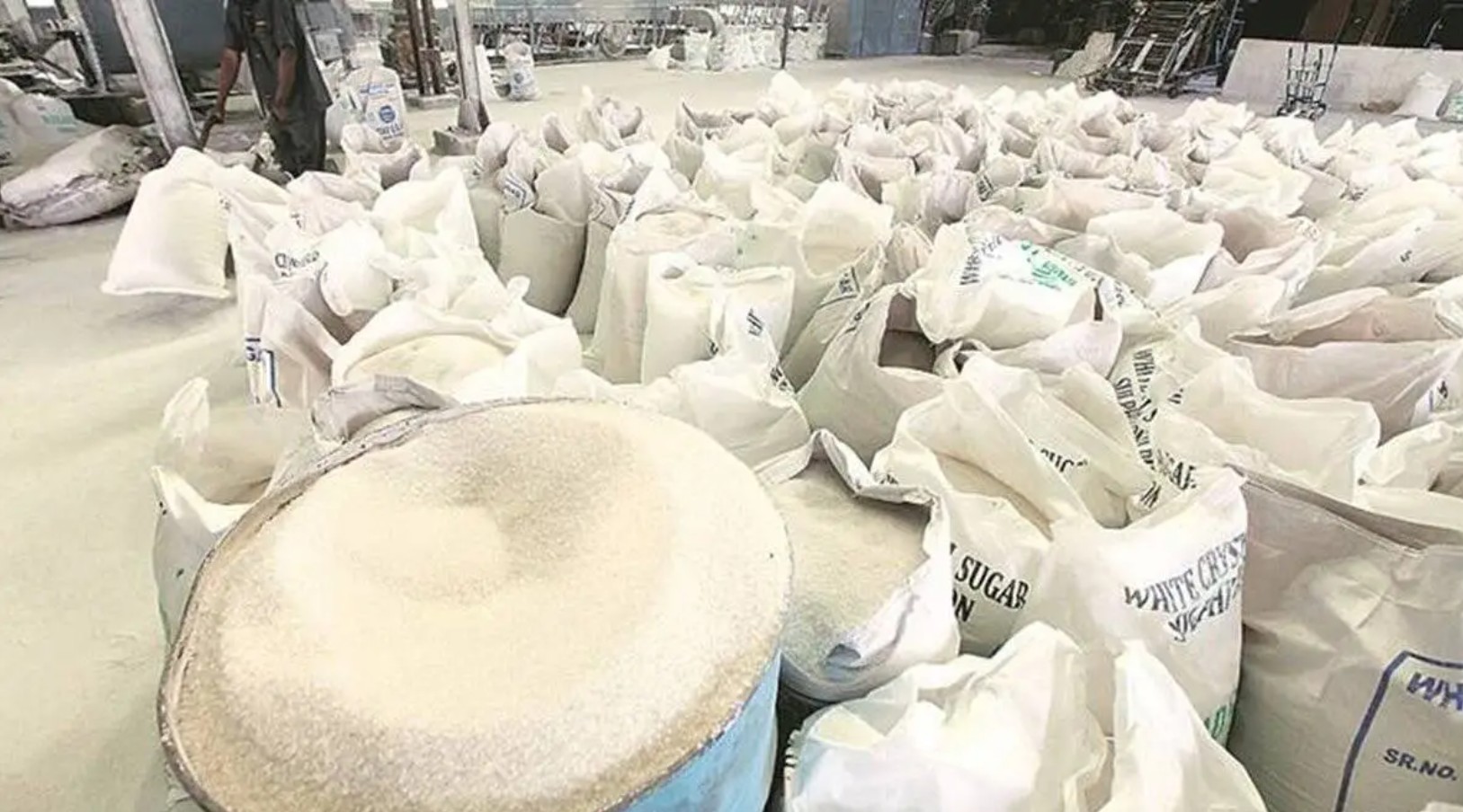 Indian sugar market with raw sugar being processed at a refinery